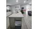 Modern kitchen with island, stainless steel appliances, and white cabinets at 1009 Fort Smith Blvd, Deltona, FL 32725