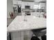Kitchen island with built in power outlet and quartz countertop at 1009 Fort Smith Blvd, Deltona, FL 32725