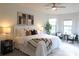Inviting bedroom with neutral color palette, cozy bedding, and ample natural light at 11637 Meadow Grove Cir, Orlando, FL 32836