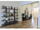 Inviting entryway featuring stylish decor, hardwood floors, and neutral paint scheme at 11637 Meadow Grove Cir, Orlando, FL 32836
