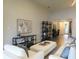 Bright living room with stylish furniture, artwork, and modern shelving at 11637 Meadow Grove Cir, Orlando, FL 32836