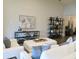 Comfortable living room features a modern shelving unit and stylish decor at 11637 Meadow Grove Cir, Orlando, FL 32836