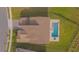 A bird's eye view of a home featuring a tile roof, landscaped yard, and private backyard pool at 13779 Abberwick Dr, Orlando, FL 32832