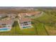 An aerial view of a home showcasing its private pool, spacious backyard, and surrounding neighborhood at 13779 Abberwick Dr, Orlando, FL 32832
