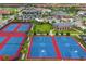 Aerial view of recreational amenities with tennis courts, basketball courts, pools, playground, and clubhouse at 13779 Abberwick Dr, Orlando, FL 32832