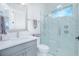 Bathroom with a modern vanity, a toilet, and a glass-enclosed shower with gray-toned tile at 13779 Abberwick Dr, Orlando, FL 32832