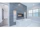 Elegant bathroom with a standalone tub, decorative fireplace, and soft lighting at 13779 Abberwick Dr, Orlando, FL 32832