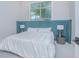 Bedroom featuring a plush headboard, soft carpeting, and ample natural light at 13779 Abberwick Dr, Orlando, FL 32832