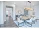 Dining room with modern table, chairs, and a bar area, perfect for entertaining guests at 13779 Abberwick Dr, Orlando, FL 32832