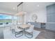 Dining area featuring modern decor and access to outdoor pool and patio at 13779 Abberwick Dr, Orlando, FL 32832