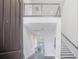 Welcoming entryway with a view of the staircase, providing a glimpse of the open-concept living space at 13779 Abberwick Dr, Orlando, FL 32832
