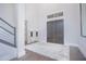 Grand foyer with high ceilings, a decorative rug, statement lamps, and elegant front doors at 13779 Abberwick Dr, Orlando, FL 32832