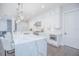 Bright kitchen featuring a marble island, white cabinetry, stainless steel appliances, and pendant lighting at 13779 Abberwick Dr, Orlando, FL 32832