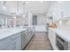Open-concept kitchen featuring stainless appliances, pendant lighting, and an island with bar seating at 13779 Abberwick Dr, Orlando, FL 32832