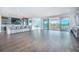 A large living area is equipped with a wet bar, stools, a pool table, and access to a patio at 13779 Abberwick Dr, Orlando, FL 32832