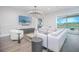 An elegant living room boasts chic decor, comfortable seating, and a large screen TV, creating a perfect space for relaxation at 13779 Abberwick Dr, Orlando, FL 32832