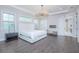 Spacious main bedroom with a chandelier, fireplace, and hard wood floors at 13779 Abberwick Dr, Orlando, FL 32832