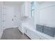Well-organized mudroom featuring built-in storage, bench seating, and stylish decor at 13779 Abberwick Dr, Orlando, FL 32832