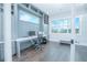 Bright office with custom built-ins, a sleek desk, and large windows offering natural light at 13779 Abberwick Dr, Orlando, FL 32832