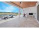 An outdoor kitchen and dining area overlooking a private pool, ideal for entertaining guests at 13779 Abberwick Dr, Orlando, FL 32832