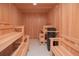 Inviting sauna room with wooden benches and paneling for a relaxing spa experience at home at 13779 Abberwick Dr, Orlando, FL 32832