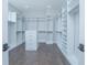Walk-in closet featuring custom shelves, drawers, and plenty of storage at 13779 Abberwick Dr, Orlando, FL 32832