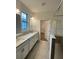 Double vanity bathroom with walk-in shower and closet at 3185 Songbird Cir, Harmony, FL 34773