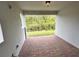 Covered patio with brick pavers and view of backyard at 3185 Songbird Cir, Harmony, FL 34773