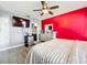 Main bedroom with king-size bed and en-suite bathroom access at 357 Red Kite Dr, Groveland, FL 34736