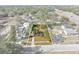 Aerial view of property surrounded by mature trees, offering a private and serene setting within a well-established neighborhood at 514 S 7Th St, Lake Wales, FL 33853