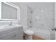 Bathroom features modern vanity, and a shower over tub with marble look tile at 514 S 7Th St, Lake Wales, FL 33853