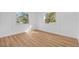 Bright room features fresh paint, new floors and two windows to the front yard at 514 S 7Th St, Lake Wales, FL 33853