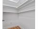 Walk in closet with white shelving and white walls at 514 S 7Th St, Lake Wales, FL 33853