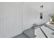 A welcoming front porch view that features a white door, gray flooring and concrete steps at 514 S 7Th St, Lake Wales, FL 33853