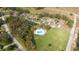 Aerial view of the neighborhood community pool surrounded by lush green common areas at 7 Huntley Ct., Haines City, FL 33844