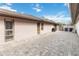 Spacious backyard patio featuring paver flooring, windows, and space for outdoor dining or relaxation at 7 Huntley Ct., Haines City, FL 33844