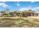 Well-maintained home exterior featuring a large yard at 7 Huntley Ct., Haines City, FL 33844
