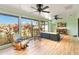 Relaxing Florida room with comfortable seating and a fireplace at 7 Huntley Ct., Haines City, FL 33844
