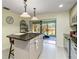 Kitchen island with granite countertops and view of backyard at 7 Huntley Ct., Haines City, FL 33844