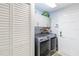Laundry room with washer, dryer, and ample storage at 7 Huntley Ct., Haines City, FL 33844