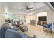 Open living area with hardwood floors, comfortable seating, and built-in entertainment center at 7 Huntley Ct., Haines City, FL 33844
