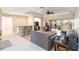 Spacious living room with hardwood floors, a cozy seating area, and access to a lanai at 7 Huntley Ct., Haines City, FL 33844