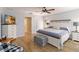 Spacious main bedroom with wood-look tile floors and ensuite bathroom at 7 Huntley Ct., Haines City, FL 33844