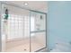 Large walk-in shower with glass enclosure and window at 7 Huntley Ct., Haines City, FL 33844