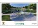 Community splash pad and playground featuring interactive water elements and shaded picnic spots at 7 Huntley Ct., Haines City, FL 33844