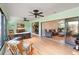 Bright sunroom features tile flooring, ceiling fans, and access to the living area at 7 Huntley Ct., Haines City, FL 33844
