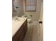 Cozy bathroom featuring a vanity, toilet, and a shower/tub combo at 116 Main St, Windermere, FL 34786