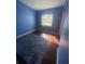 Comfortable bedroom highlighting hardwood floors, a window, and neutral wall color at 116 Main St, Windermere, FL 34786
