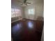 Bright bedroom featuring hardwood floors, natural light, and a dresser at 116 Main St, Windermere, FL 34786