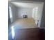 Bright living room featuring neutral walls, tile flooring, and built-in shelving for storage at 116 Main St, Windermere, FL 34786